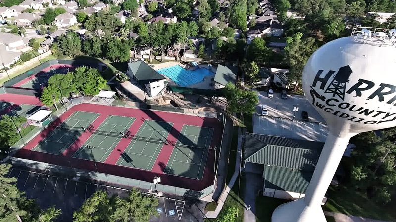 Aerial drone inspection photograph of a water tower and facility